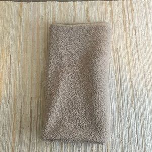 Large throw blanket. Tan color. About 5 ft by 5 ft.